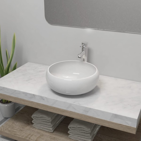 Bathroom washbasin with water to mix., bake., round, white