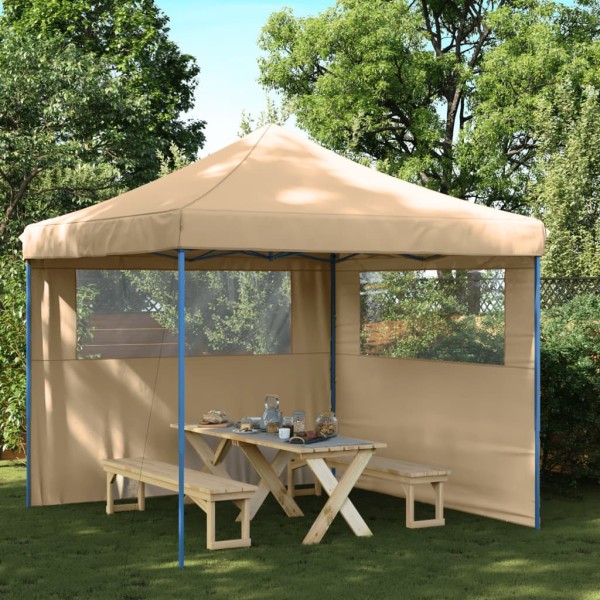 A commemorative tent with 2 side walls, sand