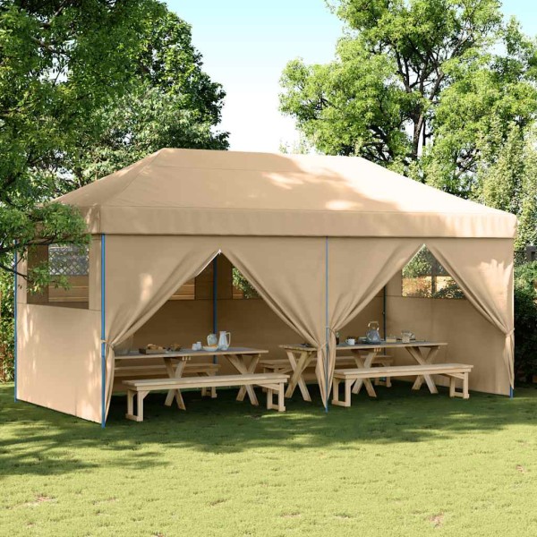 A commemorative tent with 4 side walls, sand